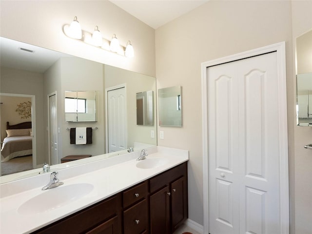 232 Carlino Dr, Nokomis, FL 34275 - ensuite bathroom with ensuite bathroom, visible vents, a sink, and double vanity