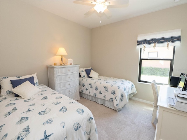 bedroom featuring ceiling fan and light colored carpet