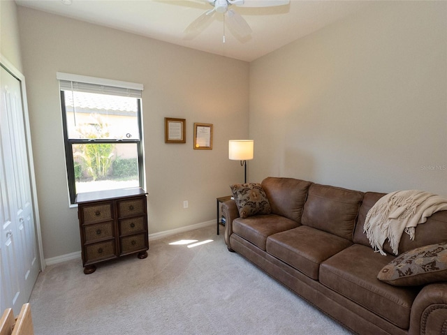 living room with light carpet and ceiling fan