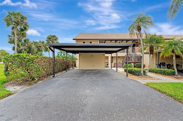 view of front of home featuring a carport