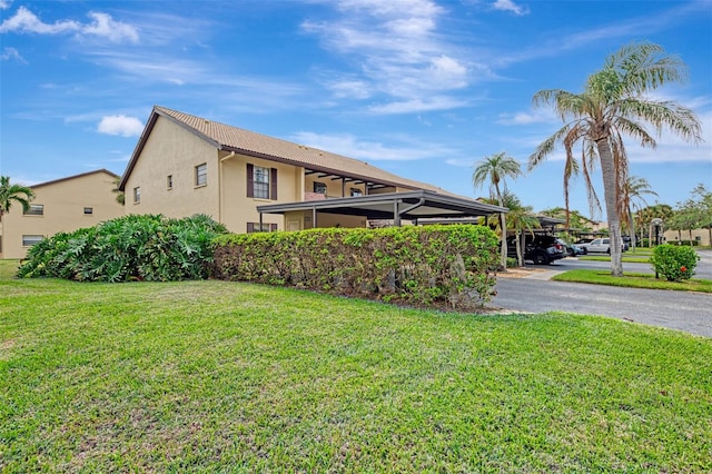 view of property exterior featuring a lawn