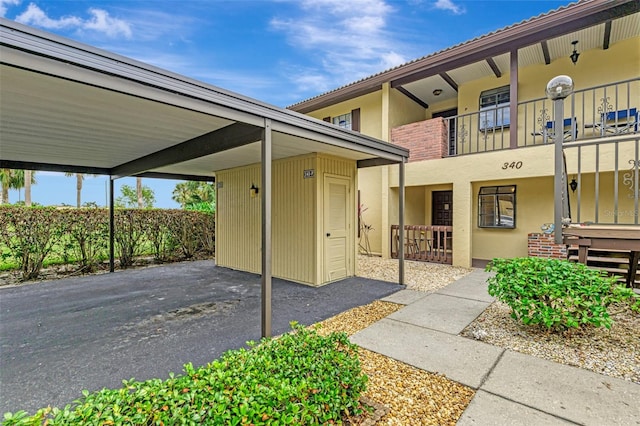 exterior space with a carport