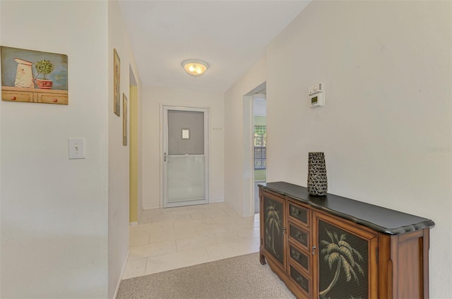 hall with light tile patterned flooring