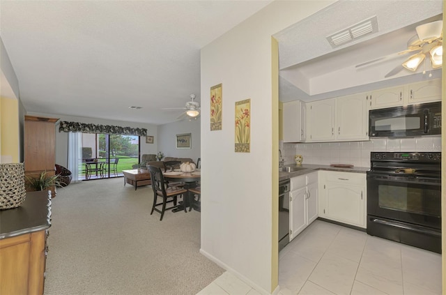 kitchen featuring white cabinetry, ceiling fan, decorative backsplash, light tile patterned flooring, and black appliances