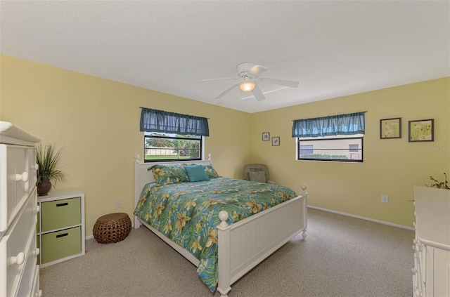 bedroom with light colored carpet and ceiling fan