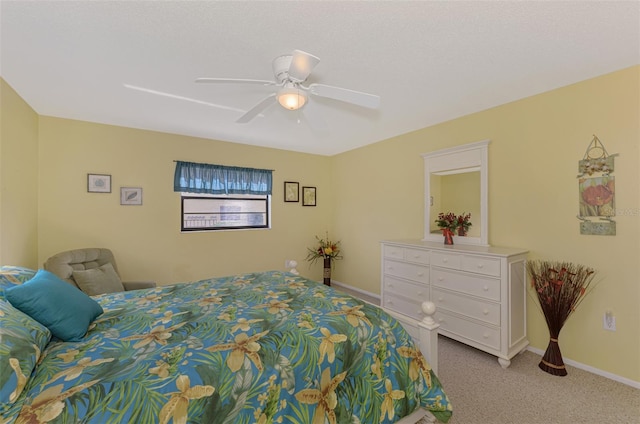 bedroom with ceiling fan and light colored carpet