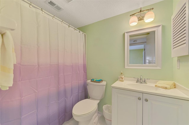 bathroom with vanity, tile patterned flooring, a shower with shower curtain, toilet, and a textured ceiling