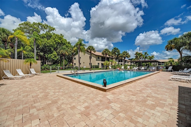 view of pool featuring a patio