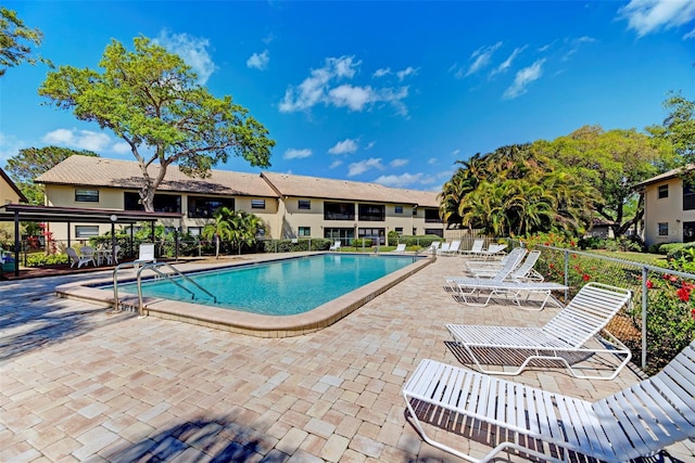 view of swimming pool featuring a patio area