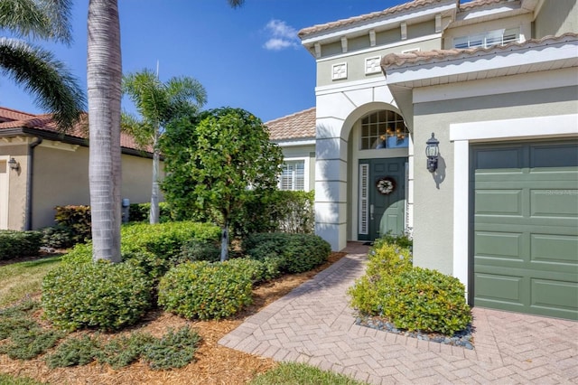 entrance to property featuring a garage