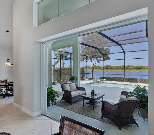 view of patio featuring a water view, an outdoor hangout area, and glass enclosure