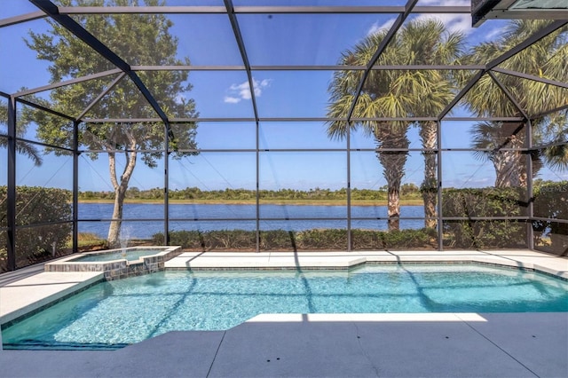 view of swimming pool featuring an in ground hot tub, a water view, glass enclosure, and a patio