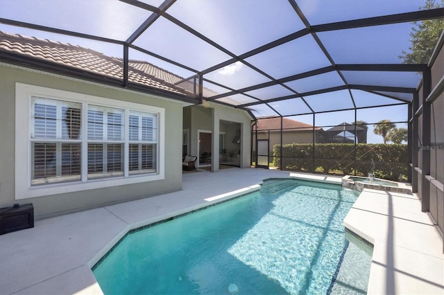 view of swimming pool with an in ground hot tub, a patio, and a lanai