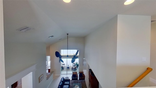 stairs featuring vaulted ceiling