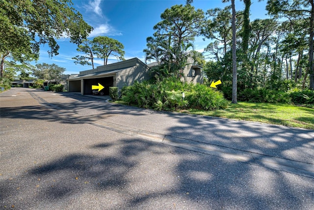 view of side of home featuring a garage