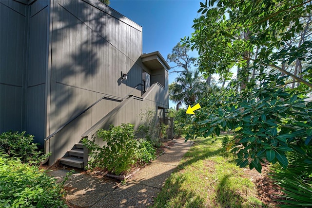 201 Woodland Dr Unit 201, Osprey, FL 34229 - view of side of home with stairs