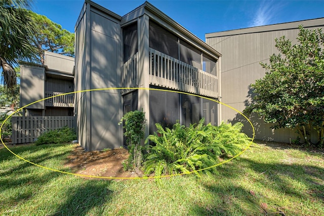 view of home's exterior with a yard