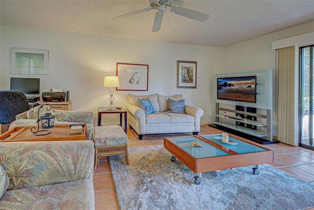 tiled living room featuring a textured ceiling and ceiling fan