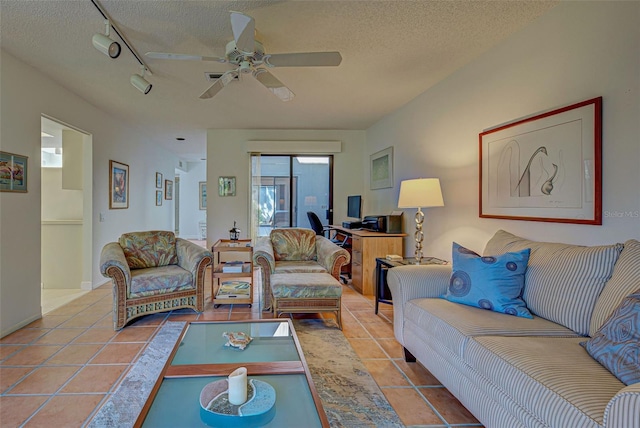 201 Woodland Dr Unit 201, Osprey, FL 34229 - living room featuring tile patterned flooring, a textured ceiling, a ceiling fan, and rail lighting