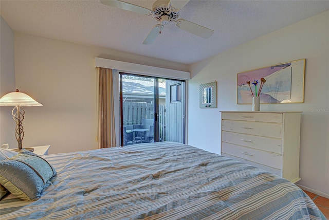 tiled bedroom with a textured ceiling, access to outside, and ceiling fan