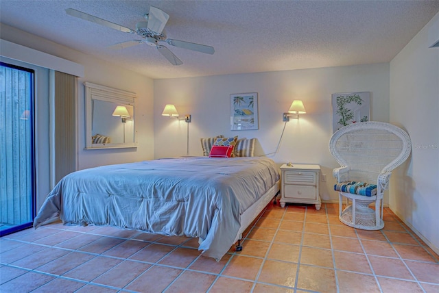 bedroom with a textured ceiling, light tile patterned floors, and ceiling fan