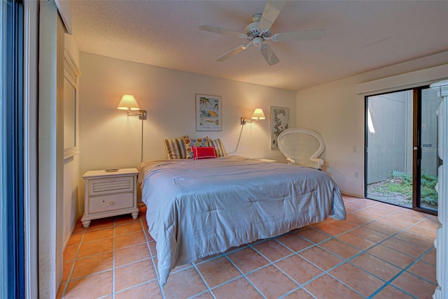 bedroom featuring a textured ceiling, access to outside, light tile patterned flooring, and ceiling fan