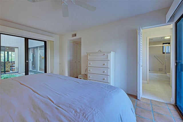 201 Woodland Dr Unit 201, Osprey, FL 34229 - tiled bedroom featuring connected bathroom, access to outside, a ceiling fan, and baseboards