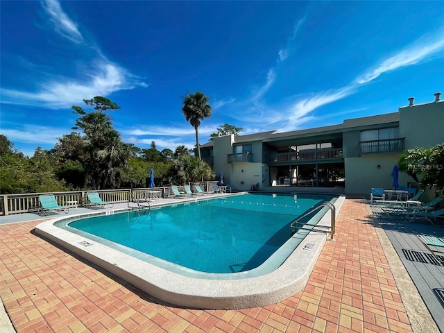 view of swimming pool featuring a patio