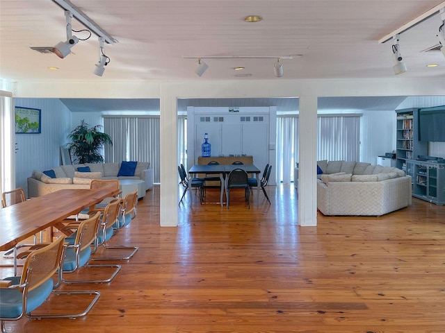 201 Woodland Dr Unit 201, Osprey, FL 34229 - dining room featuring rail lighting and hardwood / wood-style flooring