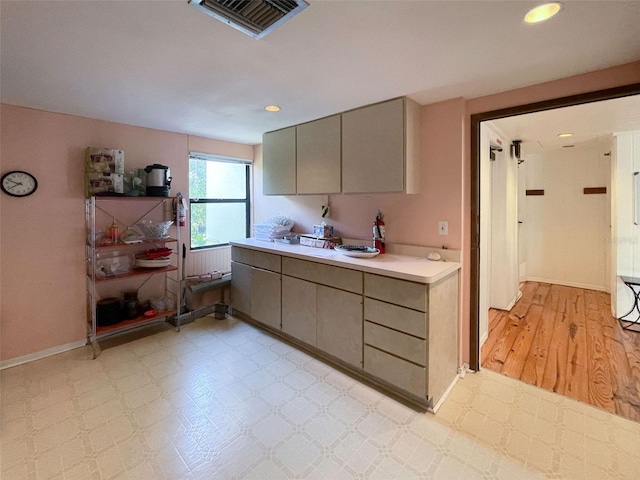 201 Woodland Dr Unit 201, Osprey, FL 34229 - kitchen with gray cabinetry, light countertops, baseboards, light floors, and recessed lighting