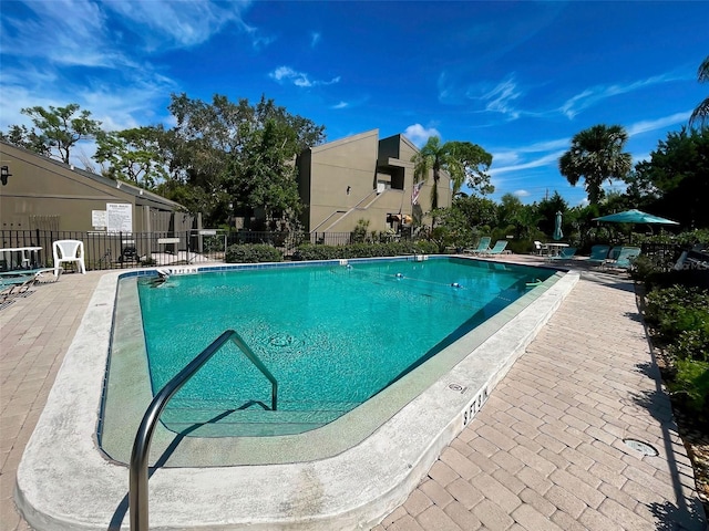 view of swimming pool featuring a patio