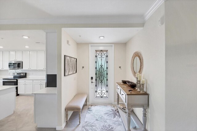 tiled entryway with crown molding