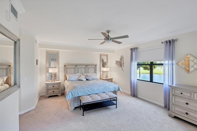 bedroom with ceiling fan, light carpet, and crown molding