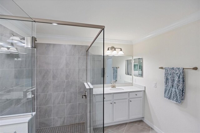 bathroom featuring ornamental molding, tile patterned flooring, walk in shower, and vanity