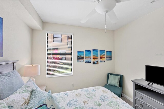 bedroom featuring ceiling fan and multiple windows