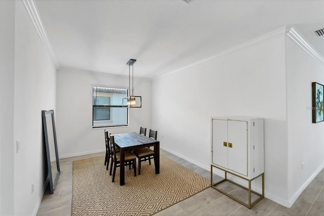 dining area featuring ornamental molding and a notable chandelier