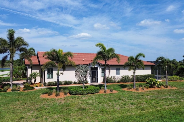 ranch-style house featuring a front yard