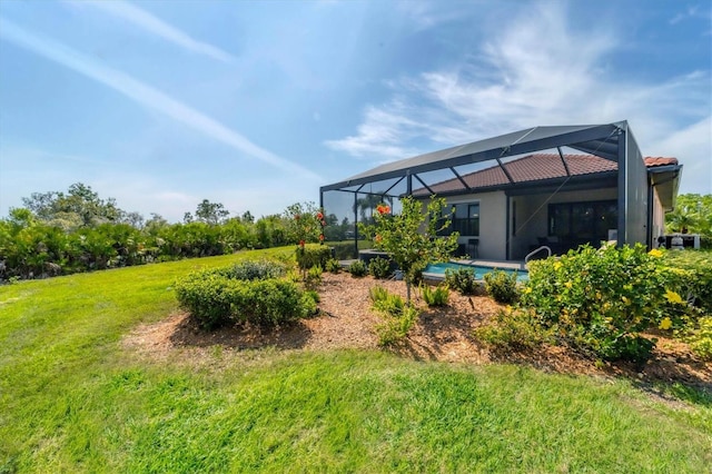 view of yard featuring glass enclosure