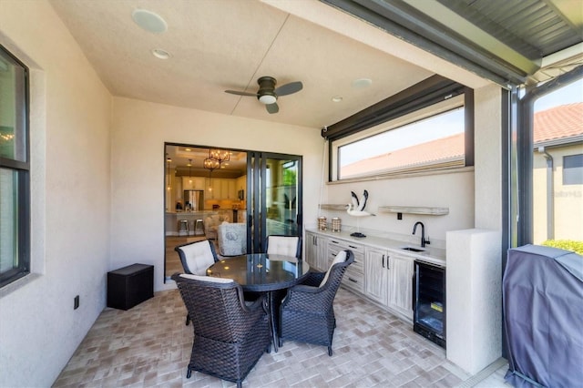 view of patio / terrace with ceiling fan, sink, wine cooler, grilling area, and area for grilling