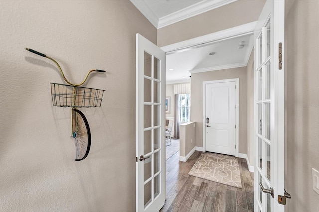 doorway to outside featuring hardwood / wood-style floors, french doors, and ornamental molding