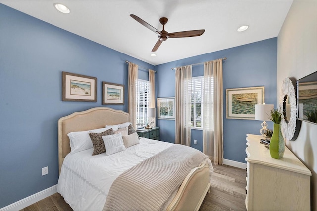 bedroom with hardwood / wood-style flooring and ceiling fan