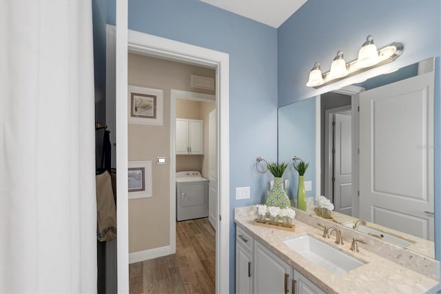 bathroom featuring hardwood / wood-style floors and vanity