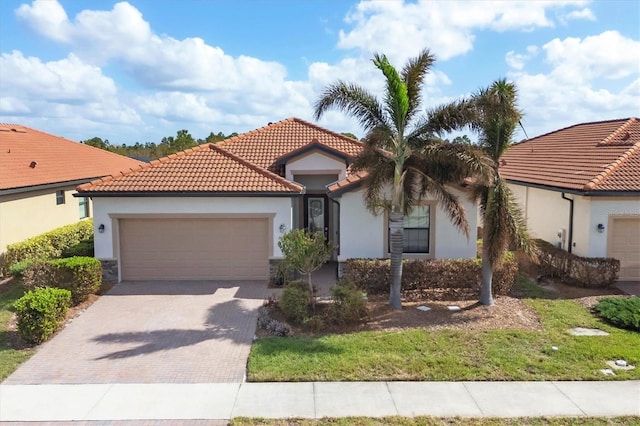 mediterranean / spanish-style house featuring a garage