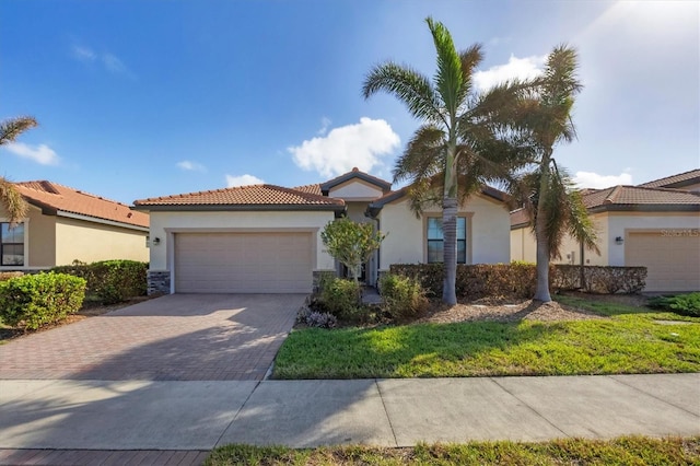 mediterranean / spanish-style house featuring a garage