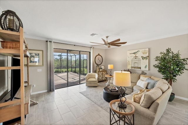 living room featuring ceiling fan and ornamental molding