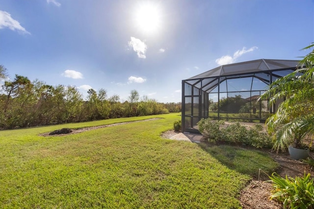 view of yard with glass enclosure