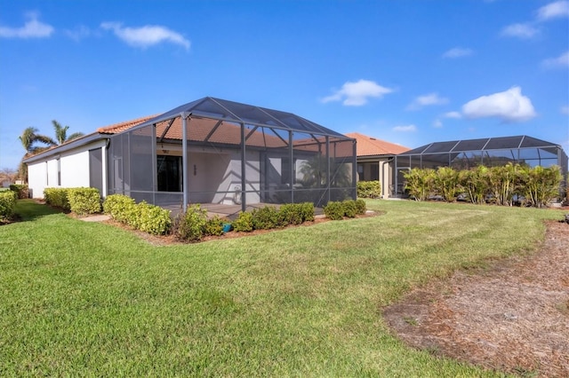 view of yard with glass enclosure