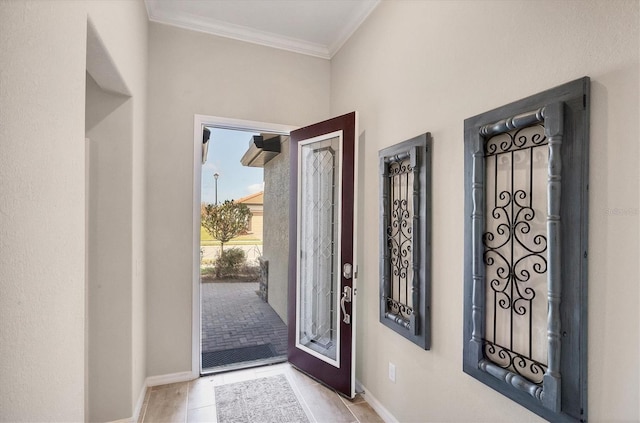 foyer featuring ornamental molding