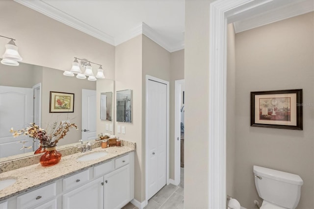 bathroom featuring vanity, ornamental molding, and toilet