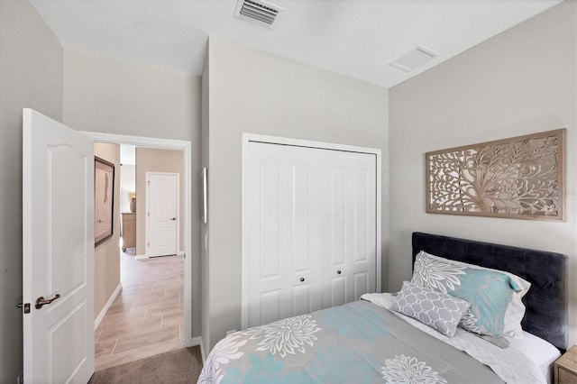 bedroom featuring hardwood / wood-style flooring and a closet